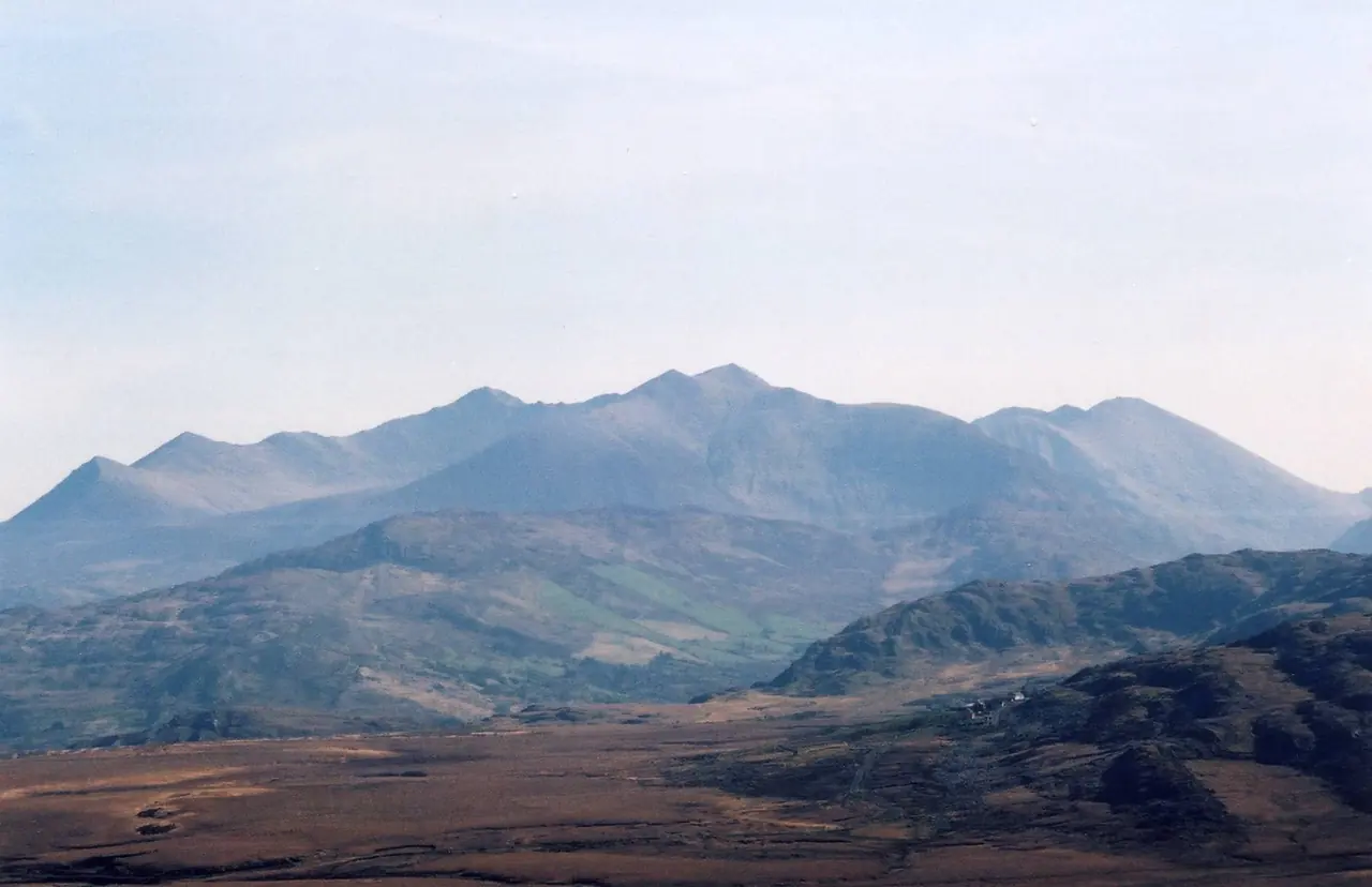 MacGillycuddy’s Reeks under a pale sky, with bogland in the foreground